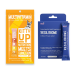 Kitty Up pet supplement bundle featuring an orange Multivitamin pouch and a blue Resilibiome supplement box with two blue sachets, on a white background.