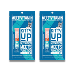 Two blue packages of Kitty Up Multivitamin cat treats shown side by side on a white background. The packaging features a cat illustration and product branding.